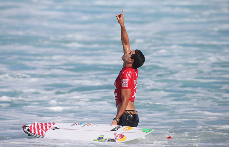 Adriano De Souza of Brasil (pictured) points to the sky after his  Quarterfinal victory at the Buillabong Pipe Masters on Thursday December 17, 2015.